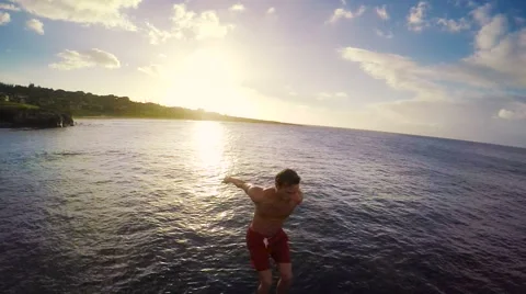 Slow Motion Sunset Cliff Jumping Backflip. Athletic Young Man Jumping From Cl Stock Footage 57223808