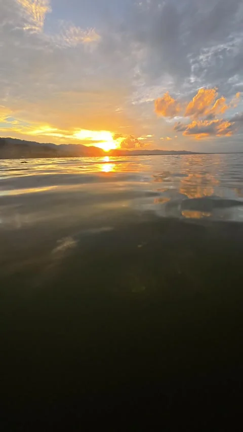 Slow motion of sunset on the lake, reflection in the water Stock Footage 299723691