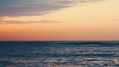 Slow motion sunset ocean waves rolling gently toward shore 스톡 동영상 343380266