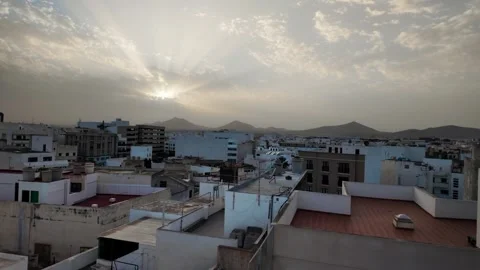 Slow motion sunset over Arrecife urban landscape and mountains, Lanzarote, Spain Stock Footage 346375498