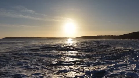 Slow Motion Sunset Over Ocean Waves Near Coastline in 4K Stock Footage 332944505