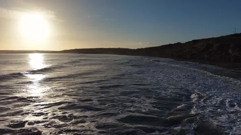 Slow Motion Sunset Over Ocean Waves Near Coastline in 4K 库存影片 332944642