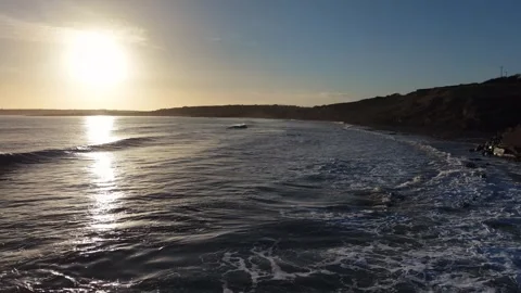 Slow Motion Sunset Over Ocean Waves Near Coastline in 4K 스톡 동영상 332944660