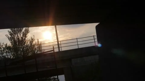 Slow motion of a sunset under a bridge Stock-Footage 51723730