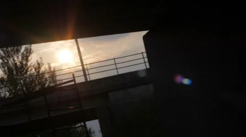 Slow motion of a sunset under a bridge 스톡 동영상 51726778