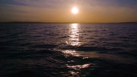 Slow motion sunset on the water Stock Footage 123392304