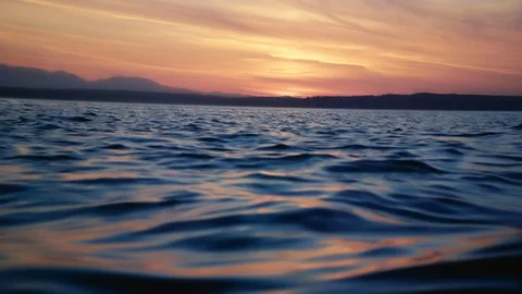 Slow motion sunset on the water Stock Footage 123392309