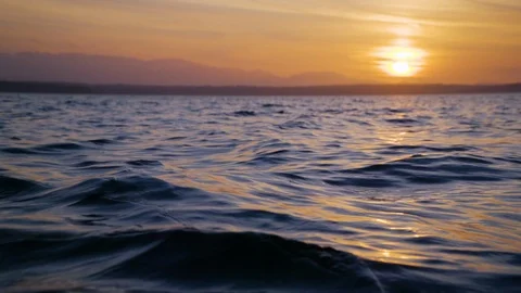 Slow motion sunset on the water Stock Footage 123392314