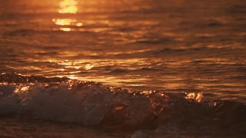 Slow motion sunset waves at sunset Stock Footage