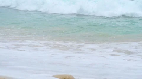 Slow motion surf or surf on sandy beach Stock Footage 132603292