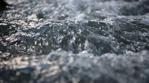 Slow motion surface boiling water in the mountan river Stock Footage 156864414