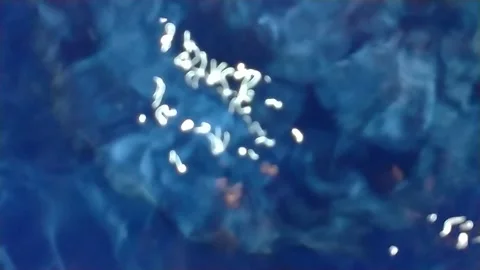 Slow motion surface boiling water Stock Footage 285833394