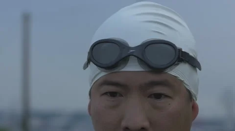 Slow motion of swimmer applying googles Stock Footage 40274232