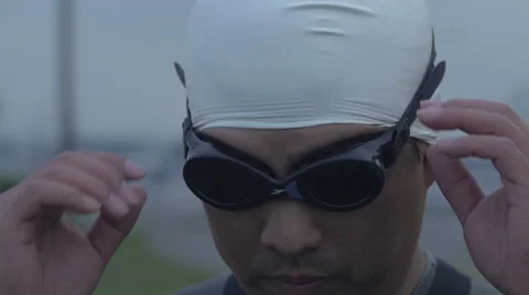Slow motion of swimmer removing goggles Stock Footage 40274223