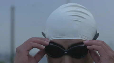 Slow motion of swimmer removing goggles Stock Footage 40274237