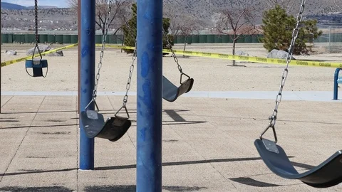 Slow Motion Swings in Locked Down Quarantined Playground Stock Footage 127326743