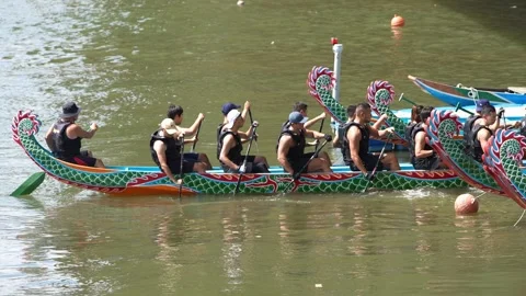 Slow motion of Taipei paddler pausing at end of stroke on lake Stock Footage 309502457