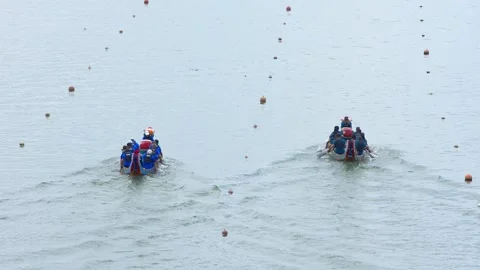 Slow motion of Taipei paddler pulling paddle into boat quietly Stock Footage 316254702