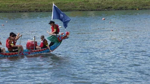Slow motion of Taipei paddler pulling paddle through lake at sunset Stock Footage 317027379