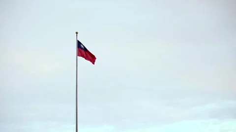 Slow motion of Taiwan flag against a serene cloudy sky Stock Footage 310853473