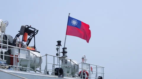Slow motion Taiwan flag rippling atop coast guard vessel mast Stock-Footage 343371810