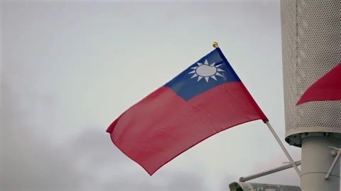 Slow motion of Taiwan flag waving gracefully against light clouds Stock Footage 310853300