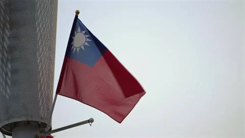 Slow motion of Taiwan flag waving on a pole against sky Stock Footage 314233576