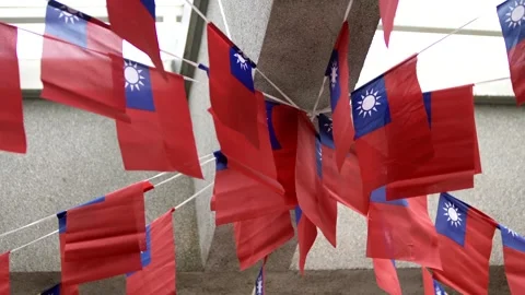 Slow motion of Taiwan flags hanging under a concrete structure Stock Footage 317402894