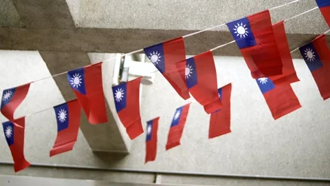 Slow motion of Taiwan flags in a modern urban courtyard Stock Footage 313950188