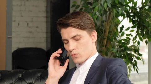 Slow motion of talking on mobile phone in office discussing business. 스톡 동영상 129637463