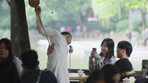 Slow motion of tea master entertaining crowd with elegant moves Stock Footage 315174902