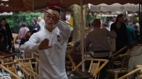 Slow motion of tea master performing with long spout teapot in Chengdu tea house Stock Footage 317513158