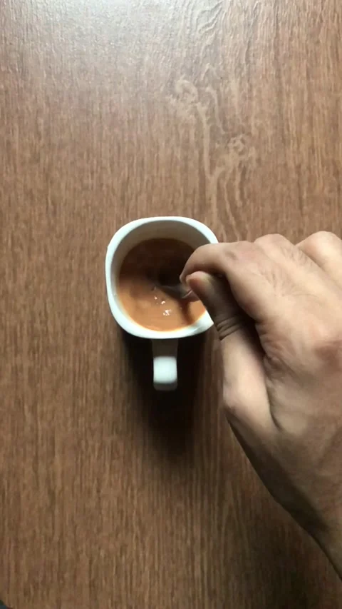 Slow motion of tea/coffee blending by spoon Stock Footage 133009009
