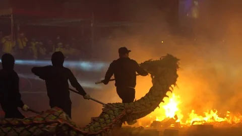 Slow motion Team of Bombing Dancing Dragon in Chinese New Year Celebration -Dan Stock Footage 75775455