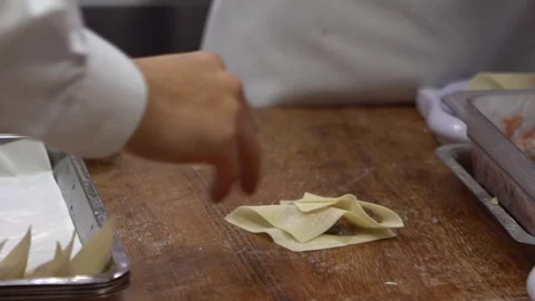 Slow motion of a team of Taiwanese chefs expertly prepares traditional dumplings Stock Footage 311423664