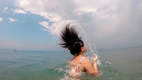 Slow motion of a teen girl spraying with... | Stock Video | Pond5