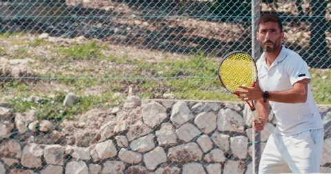 Slow motion of a tennis player hitting the ball during a tennis game Stock Footage 89804953