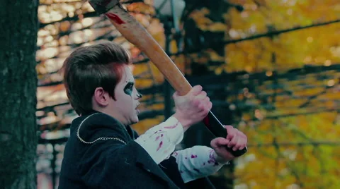 Slow motion of terrible violent monster committing murder in park at daytime 스톡 동영상 58907120