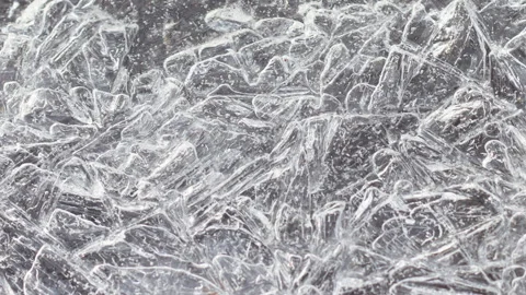 Slow motion texture of blue ice with cracked surface close-up. Video stock 160672865