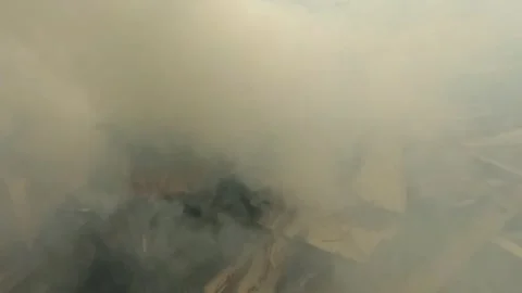 Slow motion thick smoke from burning wood waste Stock Footage 320981208