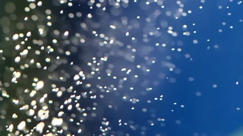 Slow motion of thousands of bubbles in the water on a blue background. Rela.. Stock Footage 254619004