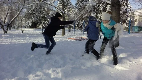 Slow motion, Three children are fighting in the snow. Video stock 88242750