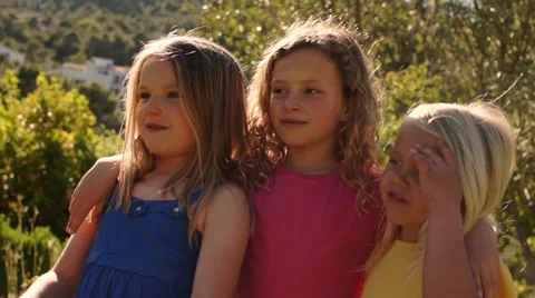 Slow motion of three children playing with bubbles in park. Stock Footage 43673321