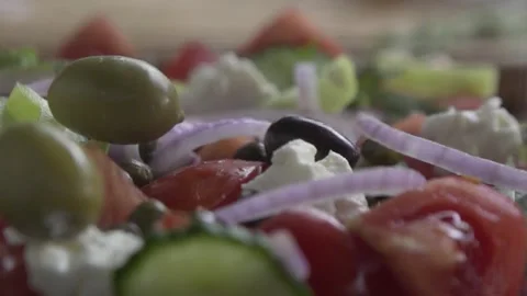 Slow motion of three olives dropping on Greek Salad Stock Footage 262459713