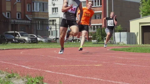 SLOW MOTION: Three young men running Stock Footage 64523638