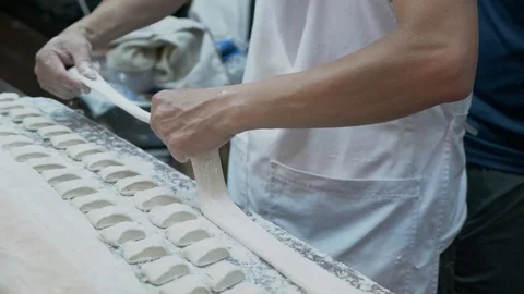 Slow motion of thresh flour for fried Chinese breadstick / doughnut cooking Stock Footage 106366042