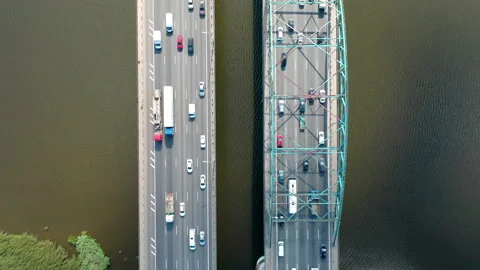 Slow motion through the bridge over river from island to island. Cars moving. Stock Footage 140818035