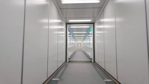 Slow Motion Through Modern Minimalist Airport Jet Bridge 스톡 동영상 329788231