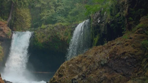 Slow Motion Tilt Down of Double Pacific Northwest Waterfall Video stock 96005766