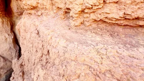 Slow Motion Tilt Down of Red Rock Waterfall Stream to Green Valley in Utah Stock Footage 340419805